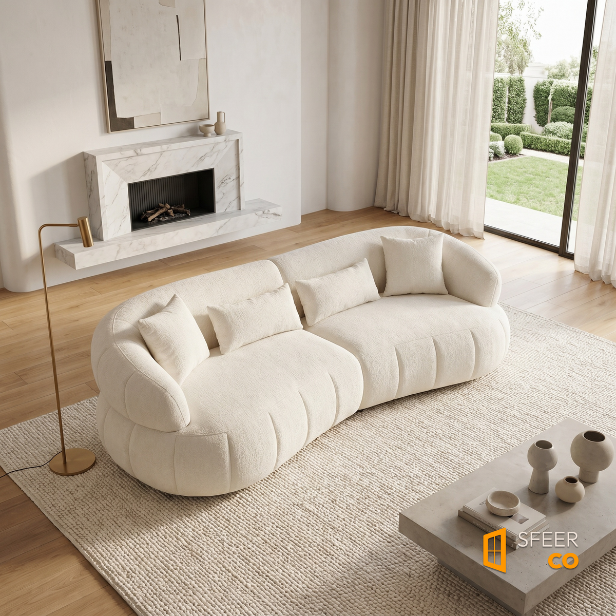Sfeerco Arco curved cloud sofa in bright open plan living room with natural light and round coffee table