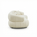 Sfeerco Arco curved sectional sofa overhead angle view showing sculptural silhouette and beige fabric