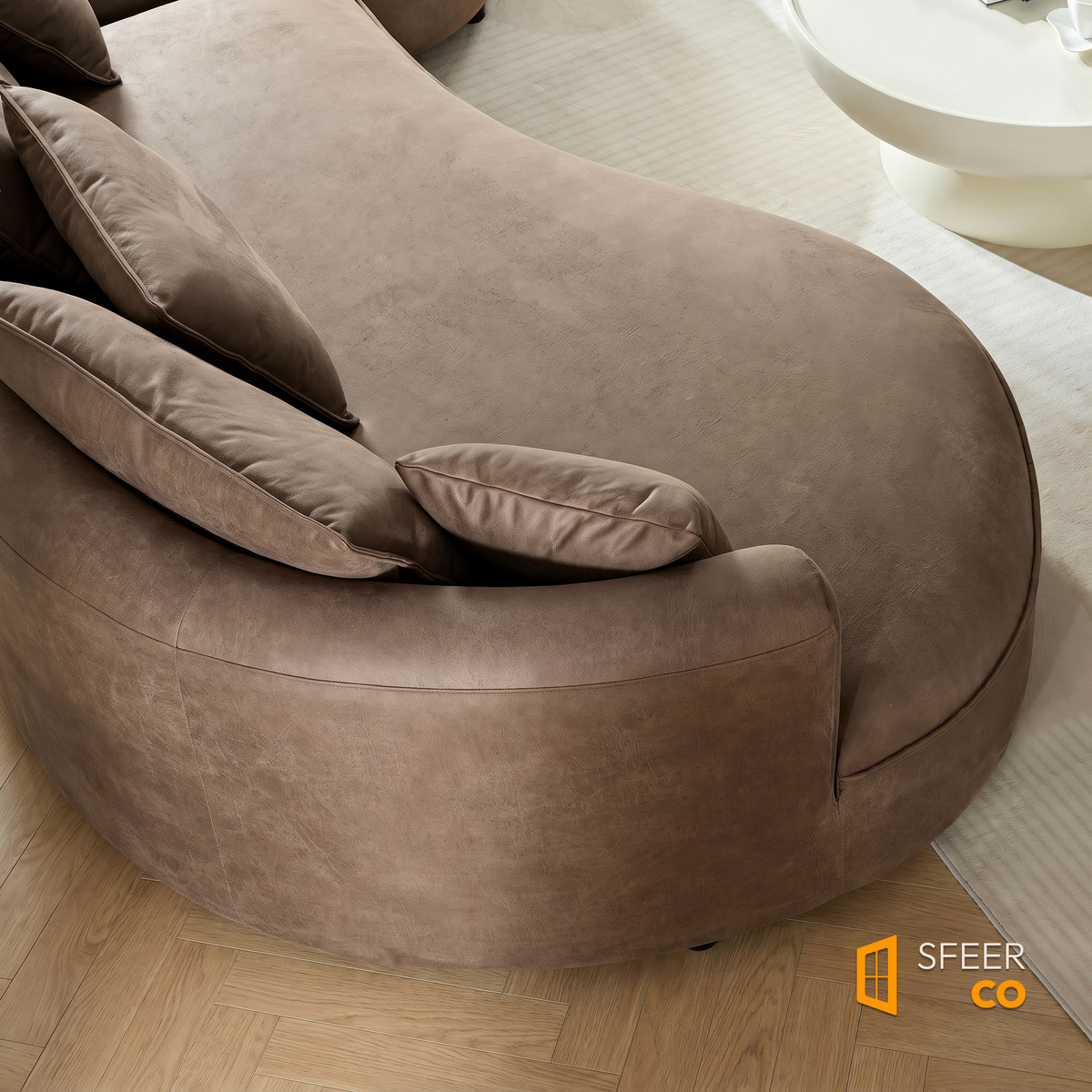 Close-up detail of brown leathaire fabric and cushion on Sfeerco Arco curved sofa