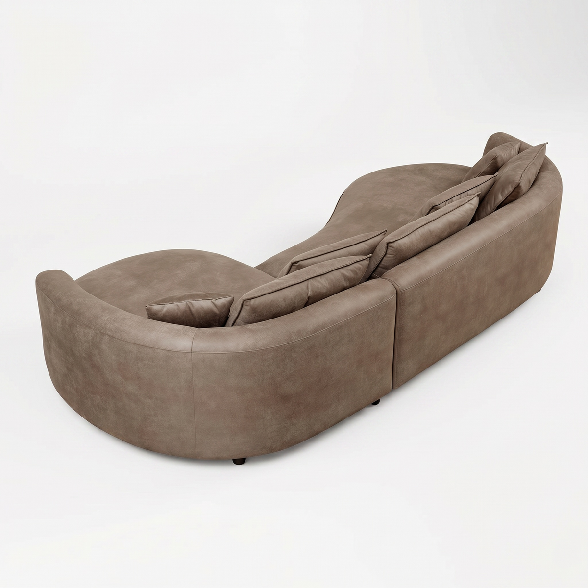Side profile of Sfeerco Arco curved sofa showing sculptural silhouette in brown leathaire