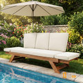 Sfeerco Brisa solid wood chaise lounge in reclined position beside pool in blooming garden