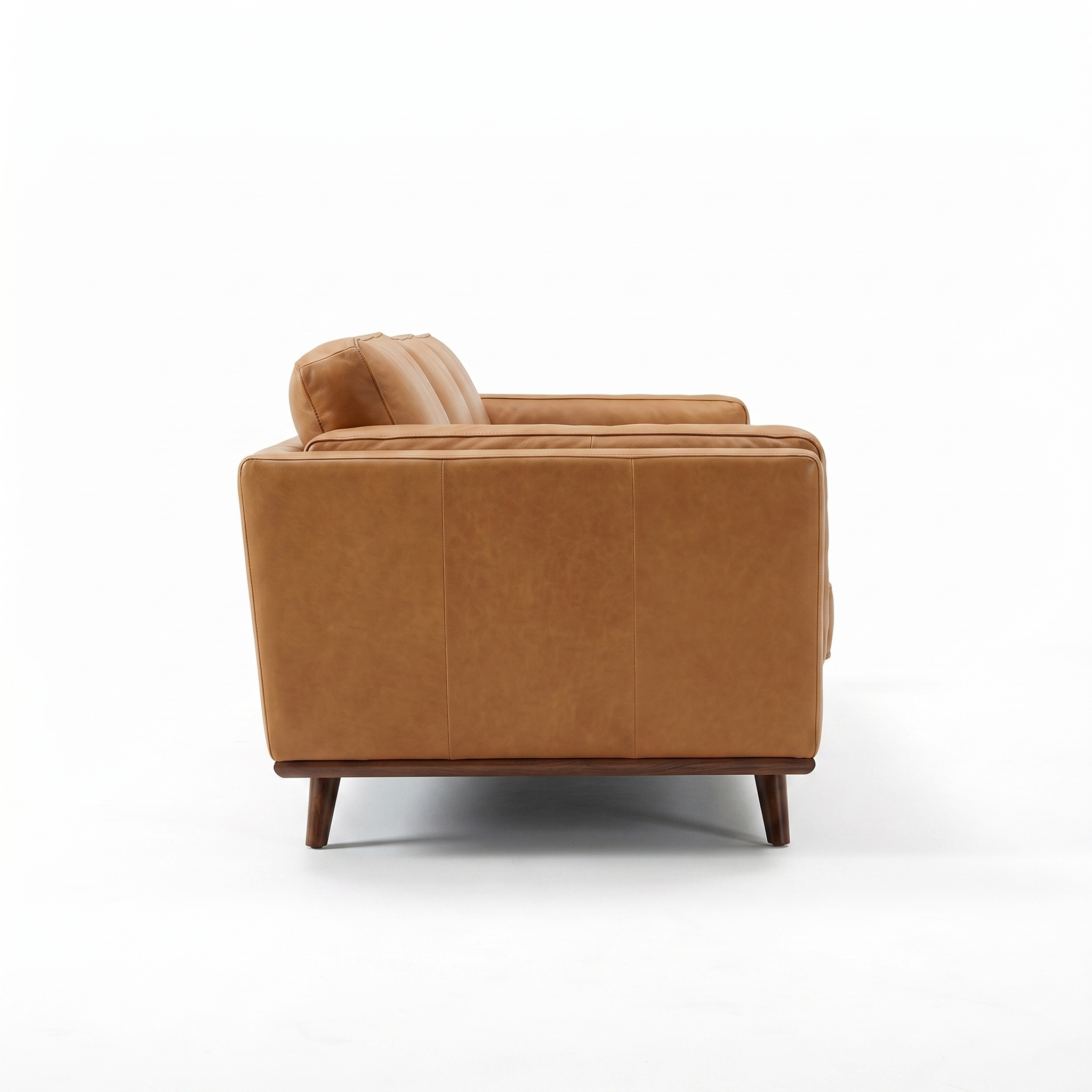 Side view of Sfeerco Caldo tan leather sofa showing solid wood legs and clean silhouette