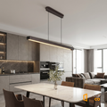 Sfeerco Casto walnut LED pendant light installed above kitchen island in dark modern interior