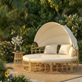 Sfeerco Coco hollow wicker rattan daybed with canopy cream white tropical garden setting