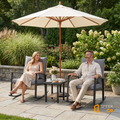 Sfeerco Deco outdoor rocking chair bistro set styled in garden patio with umbrella and couple seated