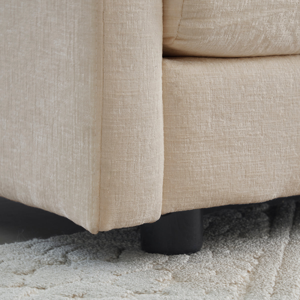 Sfeerco Dune chenille sectional sofa armrest and cushion detail showing soft fabric and stitching quality