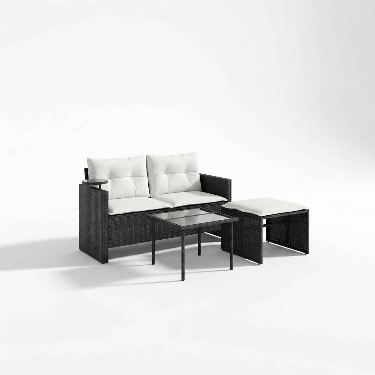 Sfeerco Noir 3-piece rattan garden sofa set with cream cushions on Mediterranean terrace