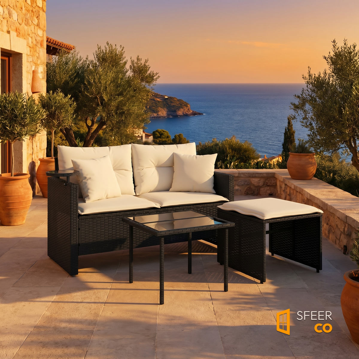 Sfeerco Noir 3-piece rattan garden sofa set with cream cushions on Mediterranean terrace at sunset