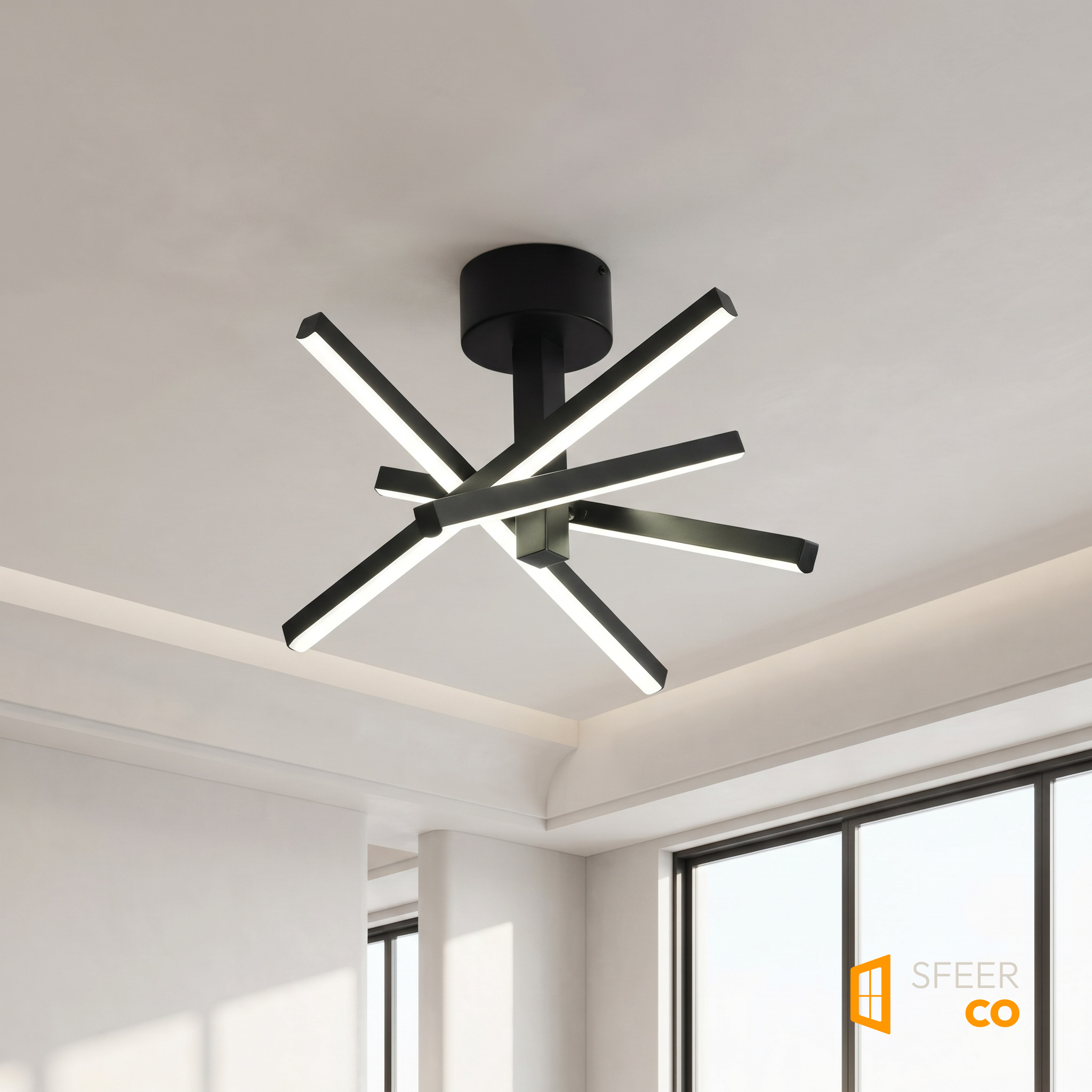 Sfeerco Nova geometric starburst LED ceiling light installed on white ceiling showing radial arm design