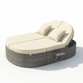 Sfeerco Orbit rattan round outdoor daybed with beige cushions pillows and adjustable backrests studio shot