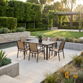 Sfeerco Porto brown patio dining set styled in manicured garden with pergola