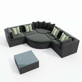 Angled view of Sfeerco Prado black wicker sectional sofa set with ottoman and striped green pillows
