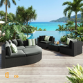 Sfeerco Prado outdoor wicker conversation sofa set on pool terrace with green accent pillows and glass table