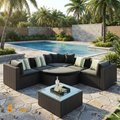 Sfeerco Prado black wicker sofa set styled poolside in tropical outdoor setting with palm trees