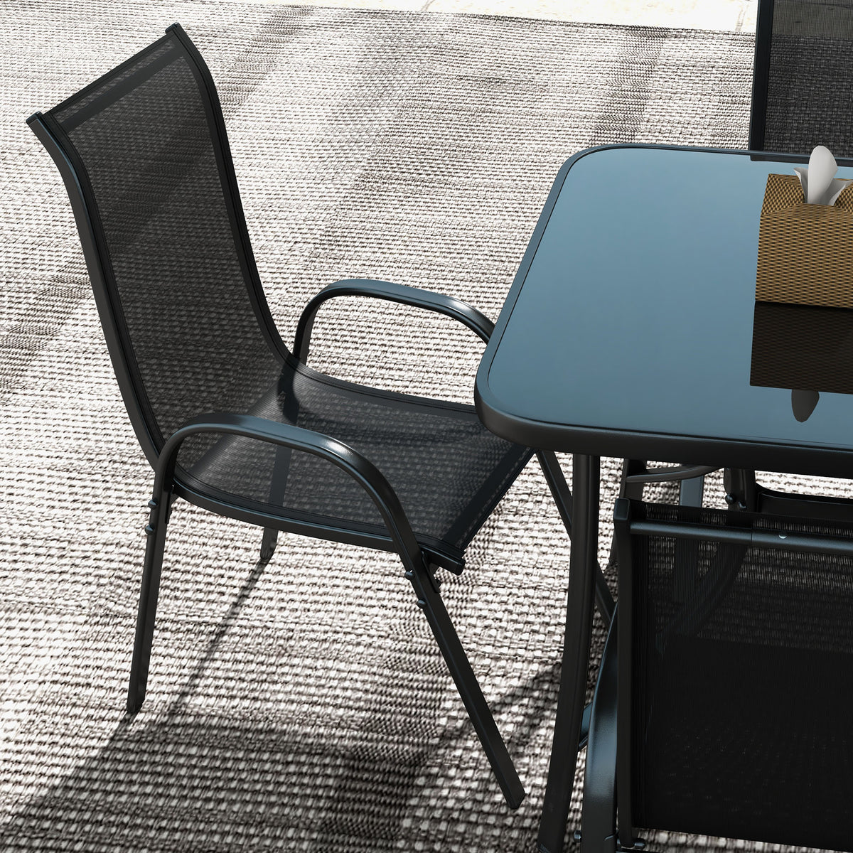 Close-up of Sfeerco Riviera stackable outdoor dining chair showing breathable mesh seat and curved design