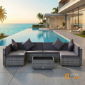 Sfeerco Slate 7-piece gray PE rattan sectional sofa set with glass coffee table beside luxury pool