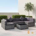 Sfeerco Slate gray rattan outdoor sectional sofa set side view with dark cushions and glass table